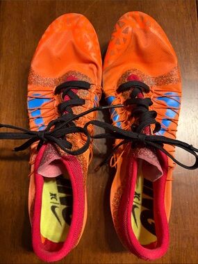 Nike Men’s Athletic running cleats Orange with Blue and Black Accents